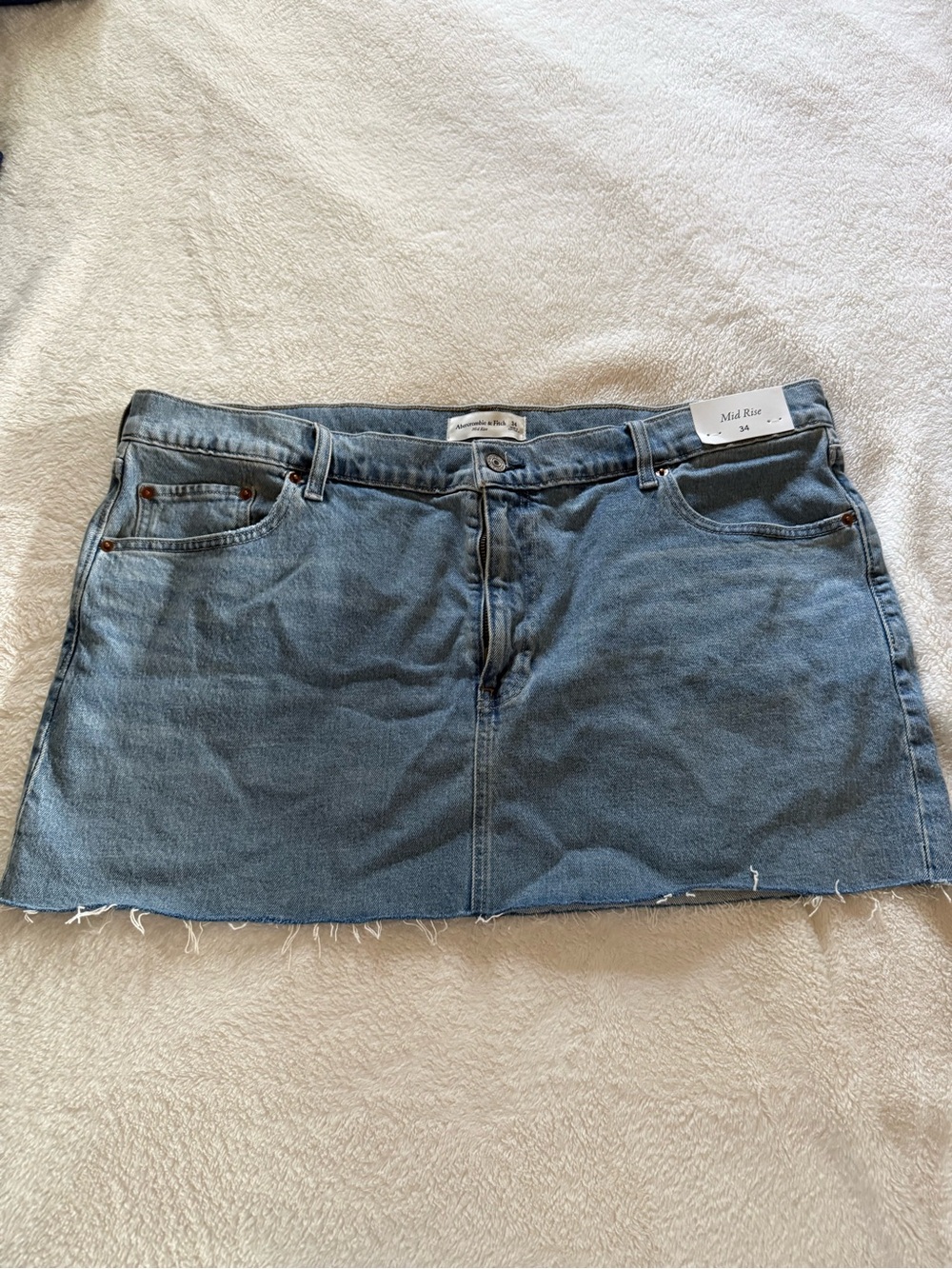 Abercrombie & Fitch mid rise denim mini Mini Skirt with Raw Edge